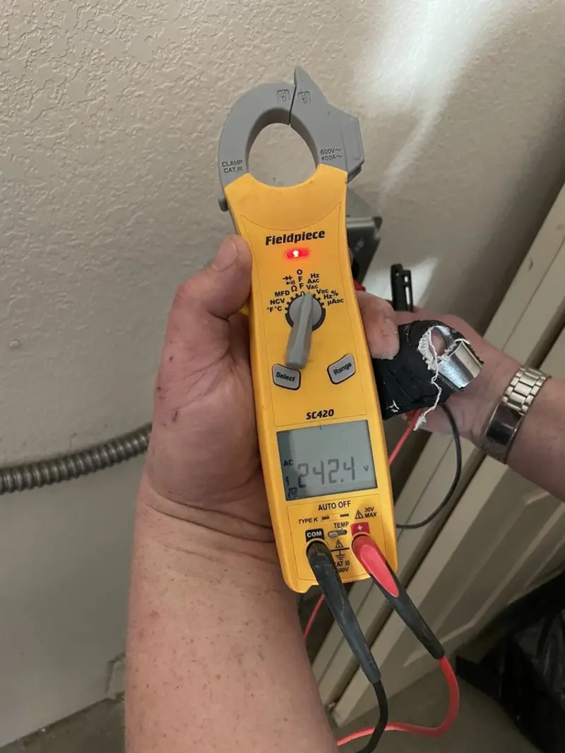Voltage testing with clamp meter during Ceiling Fan Installation in Mission